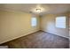 Well-lit bedroom with neutral carpeting and window blinds at 1876 Flat Shoals Se Rd, Atlanta, GA 30316