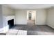 Bright living room with a fireplace and an open floor plan at 1876 Flat Shoals Se Rd, Atlanta, GA 30316