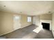 Spacious living area featuring a fireplace, hardwood floors, and neutral walls at 1876 Flat Shoals Se Rd, Atlanta, GA 30316