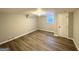 Finished basement bedroom with vinyl flooring and a door at 3721 W Potomac Dr, East Point, GA 30344