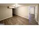 Finished basement with vinyl flooring and access to another room at 3721 W Potomac Dr, East Point, GA 30344