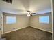Spacious bedroom with neutral walls, carpet flooring, and two windows with blinds at 3721 W Potomac Dr, East Point, GA 30344