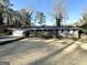 Ranch home with a large front yard and mature trees at 3721 W Potomac Dr, East Point, GA 30344