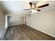 Spacious living room featuring hardwood floors and ceiling fan at 3721 W Potomac Dr, East Point, GA 30344