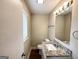 Clean bathroom with granite countertop and updated vanity at 2729 Pinella Sw Dr, Atlanta, GA 30331