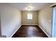 Simple dining area with hardwood flooring and neutral walls at 2729 Pinella Sw Dr, Atlanta, GA 30331