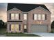 Two story brick home with gray garage door at 5324 Tolar Rd # 28, South Fulton, GA 30213