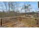 Wooden deck overlooking wooded area at 1134 Abundance Dr, Locust Grove, GA 30248