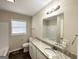 Clean bathroom with granite countertop, bathtub, and toilet at 306 Ard Nw Pl, Atlanta, GA 30331