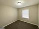 Simple bedroom with neutral walls and carpet flooring at 306 Ard Nw Pl, Atlanta, GA 30331