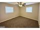 Well-lit bedroom with carpet flooring and ceiling fan at 306 Ard Nw Pl, Atlanta, GA 30331