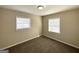 Spacious bedroom with neutral decor and two windows at 306 Ard Nw Pl, Atlanta, GA 30331