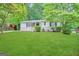 Ranch style home with a spacious lawn and mature trees at 306 Ard Nw Pl, Atlanta, GA 30331