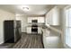 Updated kitchen, featuring granite countertops and stainless steel appliances at 306 Ard Nw Pl, Atlanta, GA 30331