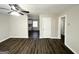 Bright living room with dark laminate flooring and view to kitchen at 306 Ard Nw Pl, Atlanta, GA 30331