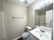 Clean bathroom with a vanity, toilet, and shower/tub combo at 263 Bakers Bridge Cir, Douglasville, GA 30134