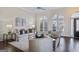 Bright living room with hardwood floors, neutral decor, and arched windows at 3156 Neal Ct, Cumming, GA 30041