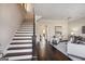 Elegant staircase with dark wood treads and white risers at 3156 Neal Ct, Cumming, GA 30041