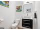 Bathroom with floating vanity, modern mirror, and decorative art at 1302 Ladd St, Atlanta, GA 30310