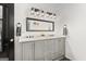 Bright bathroom featuring a double sink vanity with marble countertops, stylish lighting, and modern fixtures at 1302 Ladd St, Atlanta, GA 30310
