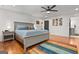 Well-lit bedroom with hardwood floors, light blue bedding and ceiling fan at 1302 Ladd St, Atlanta, GA 30310