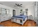 Bright bedroom with hardwood floors, decorative furniture and black ceiling fan at 1302 Ladd St, Atlanta, GA 30310