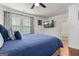 Bedroom with wood-look floors featuring bright windows, recessed lighting, ceiling fan and an ensuite bath at 1302 Ladd St, Atlanta, GA 30310