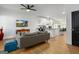 Open-concept living space with a gray sofa and views into the bright, modern kitchen at 1302 Ladd St, Atlanta, GA 30310