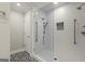 Walk-in shower with glass enclosure and patterned floors at 3509 Billingsley Dr, Marietta, GA 30062