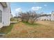 House's backyard with a patio and sparse landscaping at 9507 Byrom Rd, Jonesboro, GA 30236