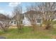 Backyard view of house with patio and surrounding trees at 9507 Byrom Rd, Jonesboro, GA 30236