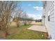 House backyard view, featuring a patio and surrounding trees at 9507 Byrom Rd, Jonesboro, GA 30236