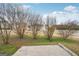 Simple backyard with a concrete patio and small trees at 9507 Byrom Rd, Jonesboro, GA 30236