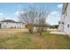 View of backyard, including a patio and neighboring houses at 9507 Byrom Rd, Jonesboro, GA 30236