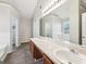 Double vanity bathroom with a view of the bathtub at 9507 Byrom Rd, Jonesboro, GA 30236