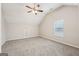 Spacious bedroom featuring grey carpet and a ceiling fan at 9507 Byrom Rd, Jonesboro, GA 30236
