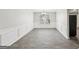 Spacious dining room with gray tile floors and wainscoting at 9507 Byrom Rd, Jonesboro, GA 30236