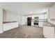 Modern kitchen with white cabinets and tile floors at 9507 Byrom Rd, Jonesboro, GA 30236