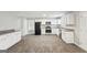 White kitchen cabinets, granite counters, tile floors at 9507 Byrom Rd, Jonesboro, GA 30236