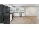 Kitchen features white cabinets and tile floors at 9507 Byrom Rd, Jonesboro, GA 30236