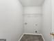 Laundry room with shelving and tile floor at 9507 Byrom Rd, Jonesboro, GA 30236