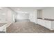 Open living area with tile floor and white cabinets at 9507 Byrom Rd, Jonesboro, GA 30236