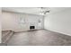 Living room with fireplace, hardwood floors and large windows at 9507 Byrom Rd, Jonesboro, GA 30236