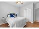 Well-lit bedroom with a full bed and double doors at 25 Chemin Pl, Sharpsburg, GA 30277