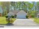 Ranch style home with attached garage and landscaping at 10252 Commons Xing, Jonesboro, GA 30238