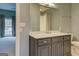 Elegant bathroom with dark vanity and marble countertop at 960 Todd Dr, Covington, GA 30014