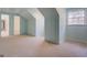 Large bedroom with light-blue walls, carpet, and doors to other rooms at 960 Todd Dr, Covington, GA 30014