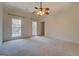 Spacious bedroom with ceiling fan and access to the outdoors at 960 Todd Dr, Covington, GA 30014