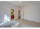 Bedroom with carpet, neutral walls, and access to bathroom and hallway at 960 Todd Dr, Covington, GA 30014