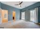 Bright bedroom with ceiling fan and access to bathroom at 960 Todd Dr, Covington, GA 30014